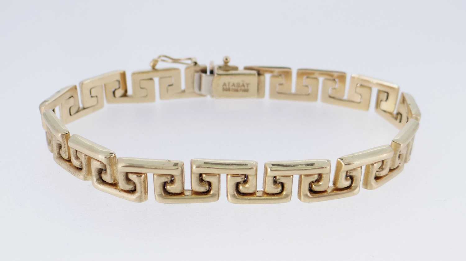 YELLOW METAL 'ATASAY' LADIES BRACELET, of key design, 20cms long, stamped '585', 14.5gms Provenance: