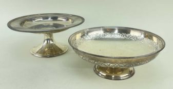 TWO SILVER COMPORTS, one with pierced border, 25cms diam., the other American silver by Gorham