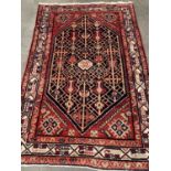 PERSIAN WOOLLEN RUG, red ground with inner white border and central large diamond, 130 x 200cms