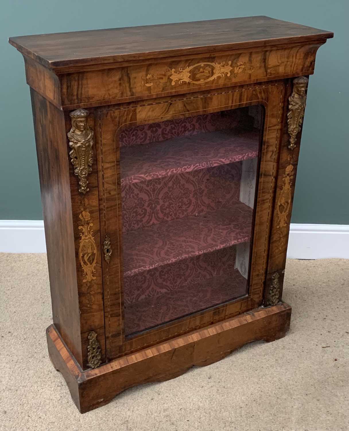 BURR WALNUT PIER CABINET having a single glazed door, with inlaid and brass embossed detail, three