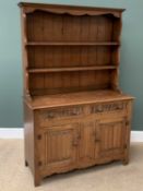 LINENFOLD OAK DRESSER by L Marcus Ltd of London, the base with two drawers over two cupboard