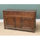 ANTIQUE OAK DRESSER BASE having three drawers over two fielded panel cupboard doors and central