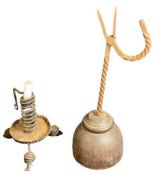 19TH CENTURY RUSH LIGHT HOLDER on a hard wood base, 40cms tall and a rustic metalware candle holder