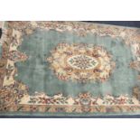 CHINESE WASHED RUG - ground green with tasselled ends. A fine example, 180 x 280cms