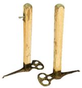 VINTAGE GROSVENOR LAWN TENNIS POSTS, A PAIR - having cast iron bases and wooden metal topped