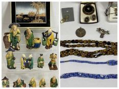 MODERN EASTERN CLAY POTTERY FIGURINES IN MAJOLICA TYPE GLAZES (2) and a framed cork picture of