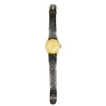 TISSOT 18CT GOLD CASED GENTLEMAN'S WRISTWATCH - on a black leather strap, the two tone dial set with