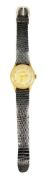 TISSOT 18CT GOLD CASED GENTLEMAN'S WRISTWATCH - on a black leather strap, the two tone dial set with