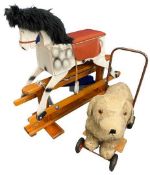 VINTAGE LEEWAY TRESTLE STAND ROCKING HORSE and a Deans Childsplay sit on/push along dog, 76cms H,