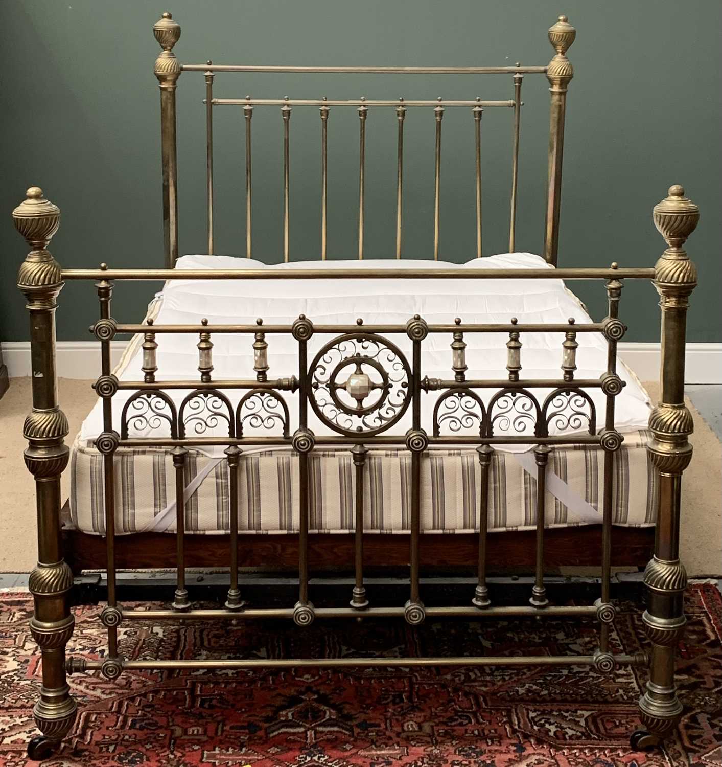 ANTIQUE BRASS FRAMED BED with wooden and sprung base and mattress, 157cms H, 145 x 218cms