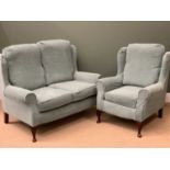 WINGBACK TWO SEATER SOFA & MATCHING ARMCHAIR - floral decorated with slip over plain covers,