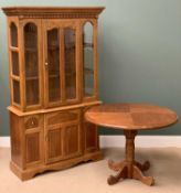 MODERN LIGHT WOOD BOOKCASE CUPBOARD with glazed upper section and lower central cupboard door,