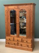 MODERN PINE WARDROBE, large example with twin glazed doors and three over two base drawers, 210cms