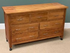 MODERN LIGHT WOOD MULTI- DRAWER CHEST on castors, 79cms H, 132cms W, 46cms D