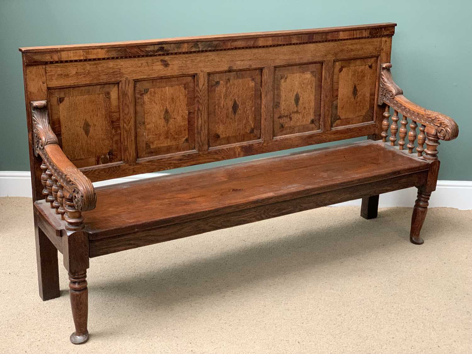 19th CENTURY OAK BENCH with a five fielded panel back, carved arms with bobbin supports, on turned - Image 2 of 5