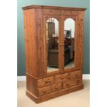 MODERN PINE WARDROBE, large example with twin glazed doors and three over two base drawers, 210cms
