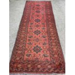 EASTERN CARPET RUNNER, red ground with multi-border and central diamond pattern, 202 x 83cms
