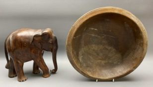 ANTIQUE SYCAMORE BOWL and a carved wood elephant ornament, 37cms diameter and 25.5cms H x 26cms L,