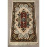 PERSIAN TYPE MULTI-COLOURED RUG with central diamond pattern, 160 x 85cms