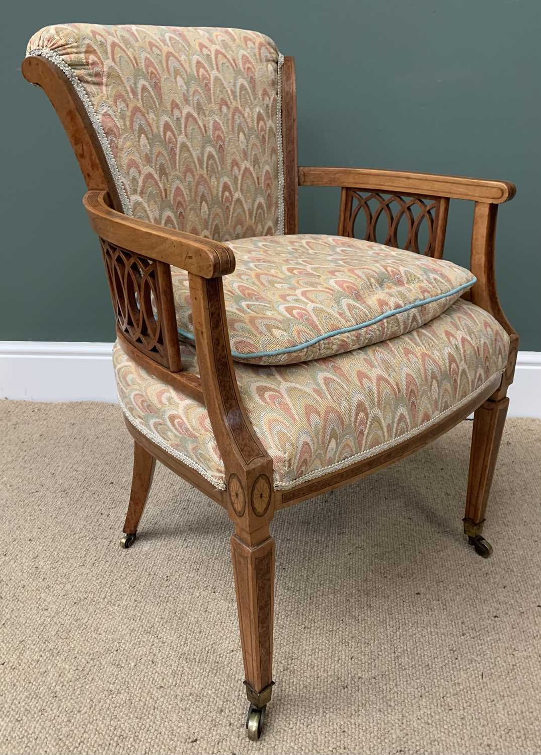 ANTIQUE MAHOGANY ELBOW CHAIR with upholstered back and seat, fretwork to the arms, on tapered and