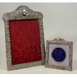 SILVER EASEL BACK PHOTOGRAPH FRAMES (2) - both having embossed decoration, Birmingham hallmarks to