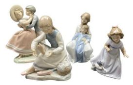 LLADRO FIGURE OF A YOUNG BOY & A GIRL EMBRACING - 25cms tall, two Nao figures and an unmarked