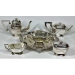 5 PIECE SILVER PLATED TEA SERVICE - on a non-associated circular four footed tray