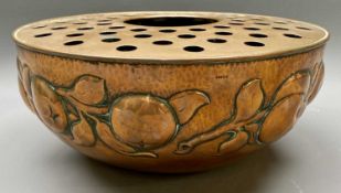 NEWLYN COPPER FLOWER BOWL - having a raised pattern of fruit and vines against a beaten copper