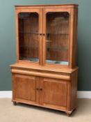 ANTIQUE PINE BOOKCASE CUPBOARD having two glazed doors over a base with central drawer and