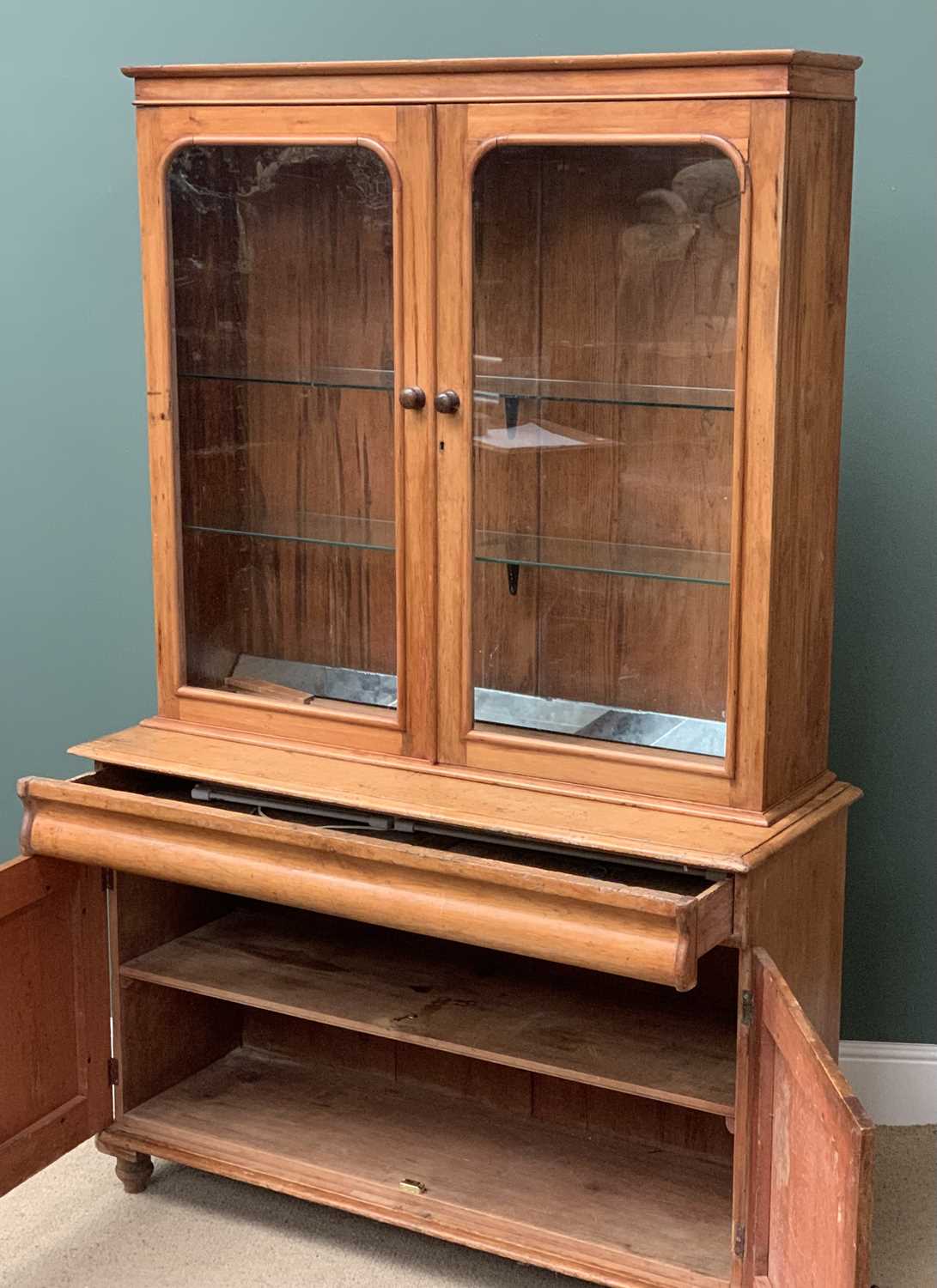 ANTIQUE PINE BOOKCASE CUPBOARD having two glazed doors over a base with central drawer and - Image 2 of 3