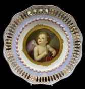 BERLIN PORCELAIN CABINET PLATE - with hand painted cherubic figure to the centre, framed in gilt