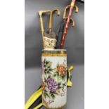 MODERN CHINESE POTTERY STICK STAND - containing a quantity of walking sticks and umbrellas, 46cms