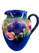 MOORCROFT ANENOME JUG - on a Cobalt Blue ground, signatures and impressed marks to the base, 20.5cms