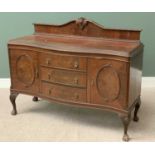 EDWARDIAN MAHOGANY SERPENTINE FRONT SIDEBOARD with three central drawers and two cupboard doors,