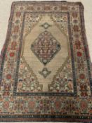 EASTERN RUG with multi-pattern border and diamond central motif, 190 x 130cms