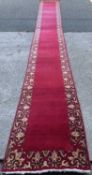 PERSIAN CARPET RUNNER, hand knotted, red ground with patterned border, 615 x 80cms