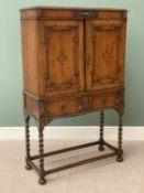 CIRCA 1900s BOOKCASE CUPBOARD on raised twist supports, having two doors over two drawers, 145cms H,