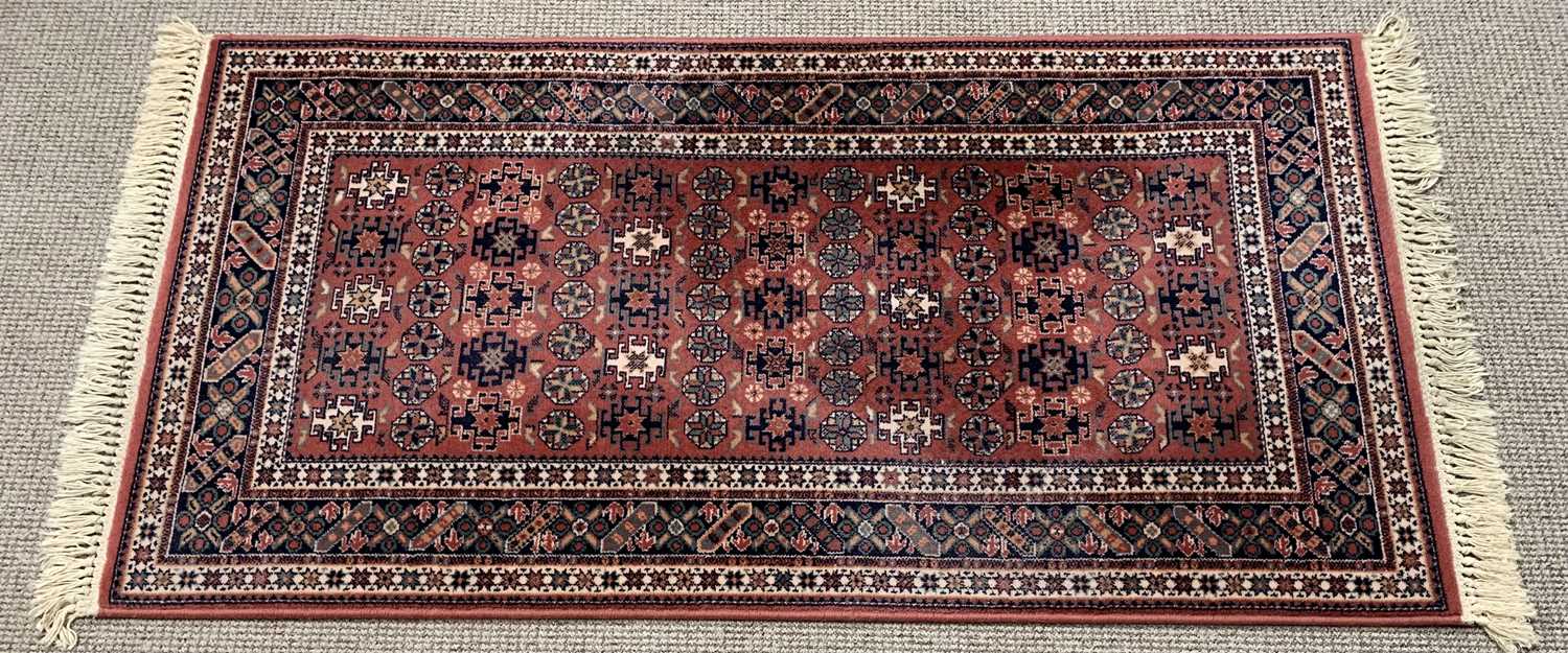 ROYAL KESHAN RUG - red ground with multi-border and Aztec/geometric design, 83 x 160cms