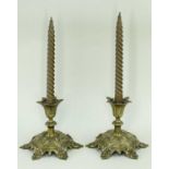 PAIR VICTORIAN GOTHIC BRASS CANDLESTICKS, the foliate sconces above short waisted necks on raised