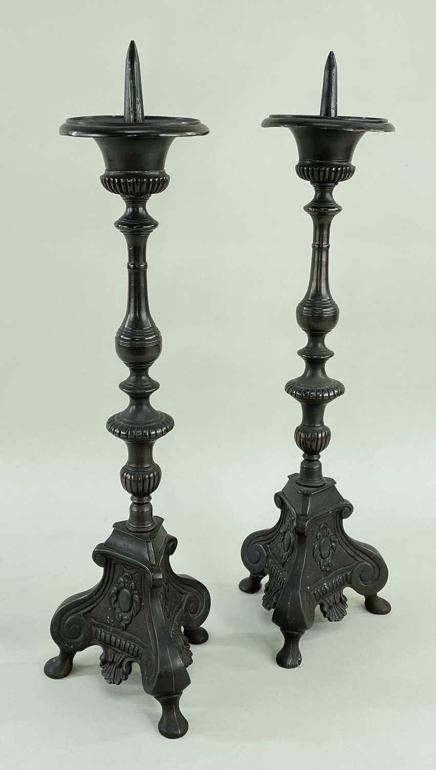 PAIR CONTINENTAL BAROQUE STYLE ALLOY PRICKET CANDLESTICKS, slender baluster...