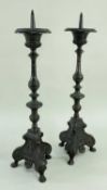 PAIR CONTINENTAL BAROQUE STYLE ALLOY PRICKET CANDLESTICKS, slender baluster stems on trefoil