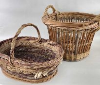 TWO TRADITIONAL WICKER BASKETS, one a circular log bin, 57cm diam., the other and oval basket,