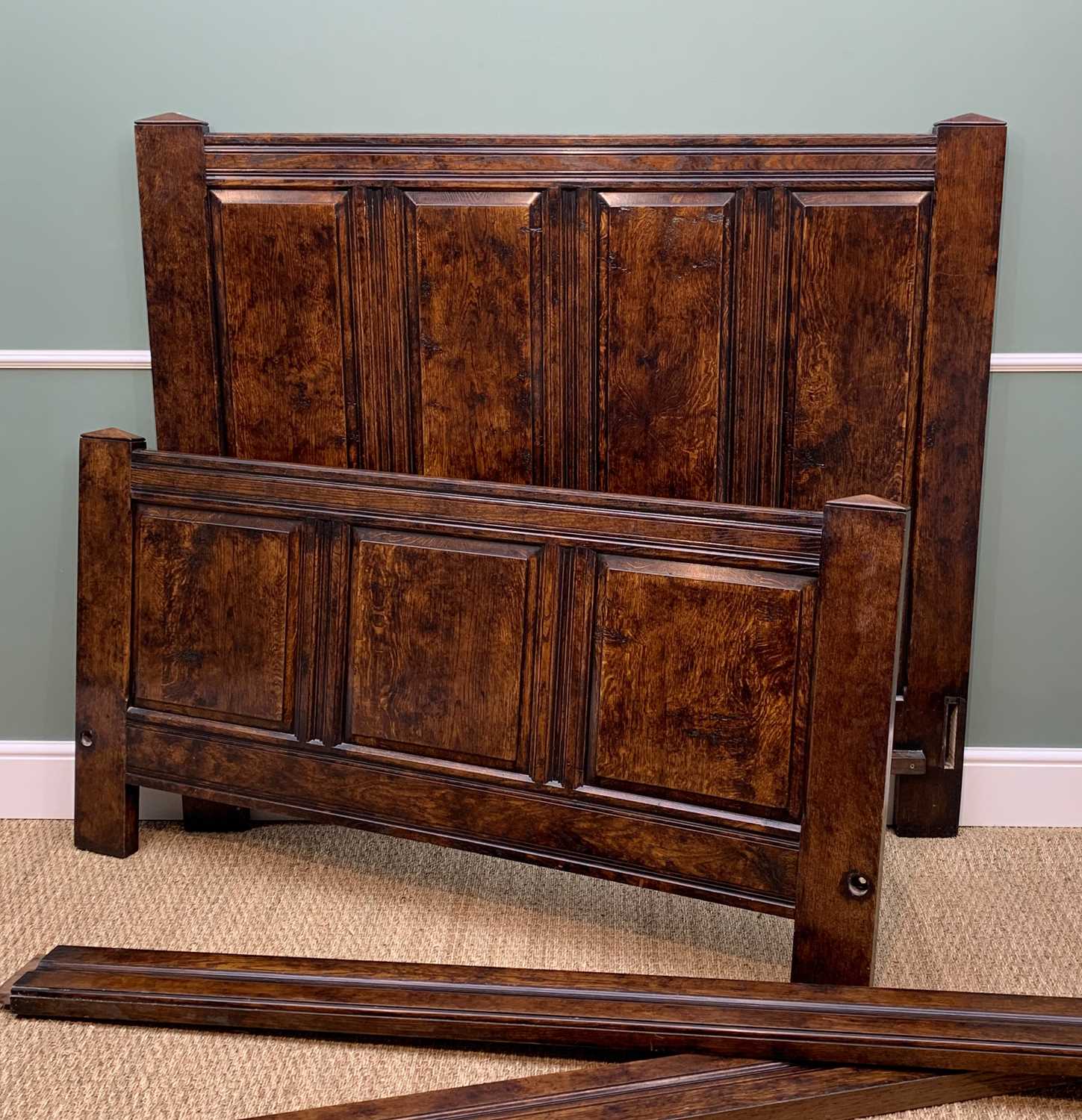 BYLAW REPRODUCTION STAINED OAK PANELLED DOUBLE BED in the 17th Century style, head board, foot board
