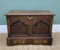 WELSH JOINED OAK COFFER BACH, moulded outer hinged top, pinted arch paneled front, canted angles,