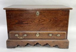 WELSH OAK COFFER BACH, moulded hinged lid, plain sides, fitted long drawer above shaped apron