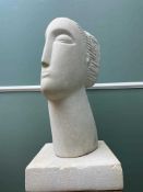 CONTEMPORARY CARVED LIMESTONE SCULPTURE OF A FEMALE HEAD, on square plinth, 61cm high