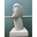 CONTEMPORARY CARVED LIMESTONE SCULPTURE OF A FEMALE HEAD, on square plinth, 61cm high