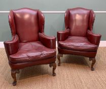 PAIR GEORGE I STYLE WING-BACK ARMCHAIRS, red leather upholstered and close nailed, carved cabriole