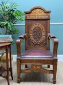 EISTEDDFOD ARM CHAIR, Welsh, 1917, carved, painted and inlaid oak, oval to back with rampant