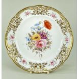 NANTGARW PORCELAIN PLATE circa 1818-1820, having a lavishly gilded border moulded with c-scrolls and